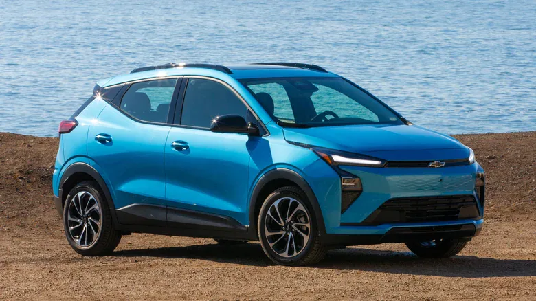 Front 3/4 view of a blue 2027 Chevrolet Bolt.