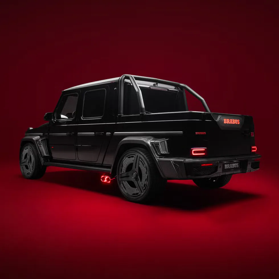 Brabus black luxury vehicle with a sleek design against a red background.